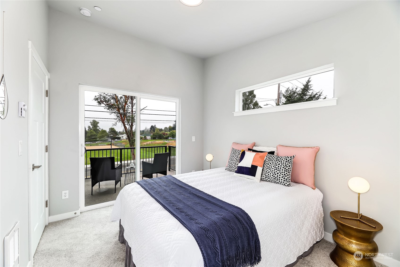 846 Southwest 136th Street, Unit 1 Burien, WA 98166 - Photo 10 of 18 a bedroom with a large bed and a large window
