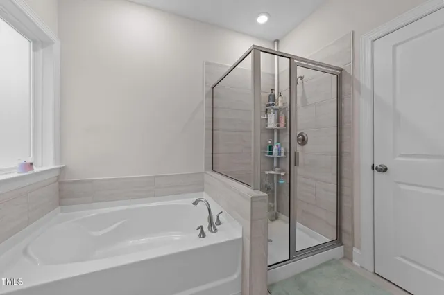 an aerial view of a house with swimming pool garden and patio