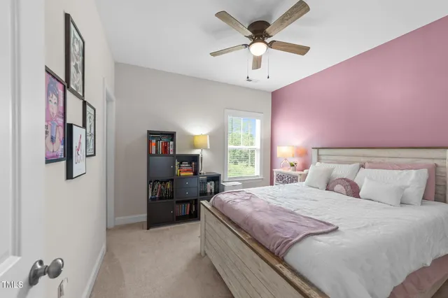 a aerial view of a house with a swimming pool and a yard