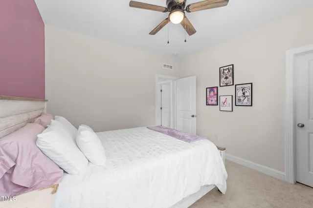 a view of a house with backyard and porch