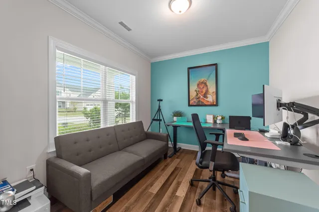 a work room with furniture and a window