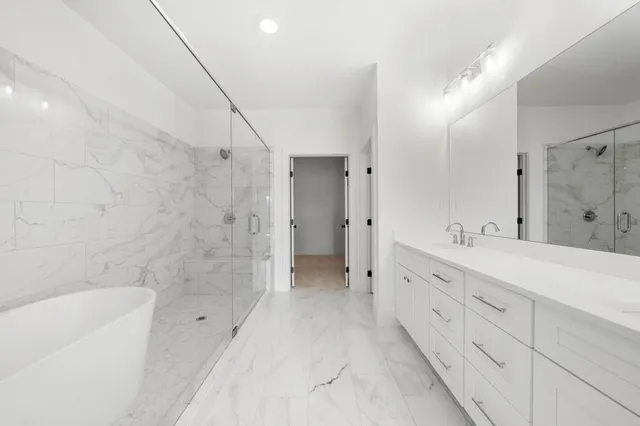 a view of a livingroom with a ceiling fan and window