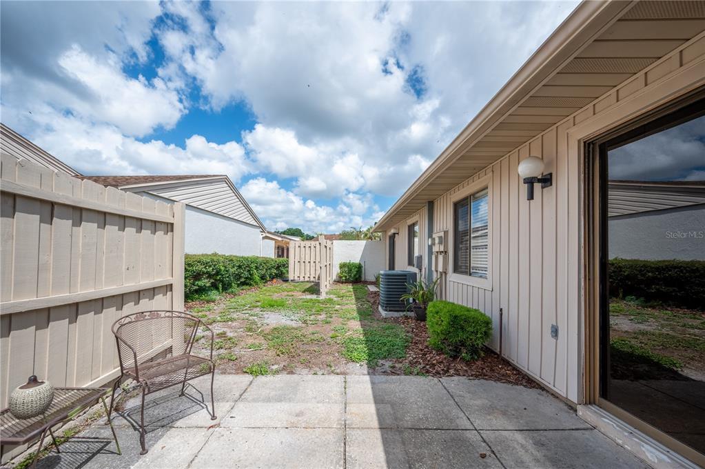 4231 Oak Loop, Unit 51 Mulberry, FL 33860 - Photo 25 of 29 a view of a porch with a tree