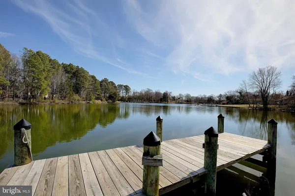 a wooden bridge near lake