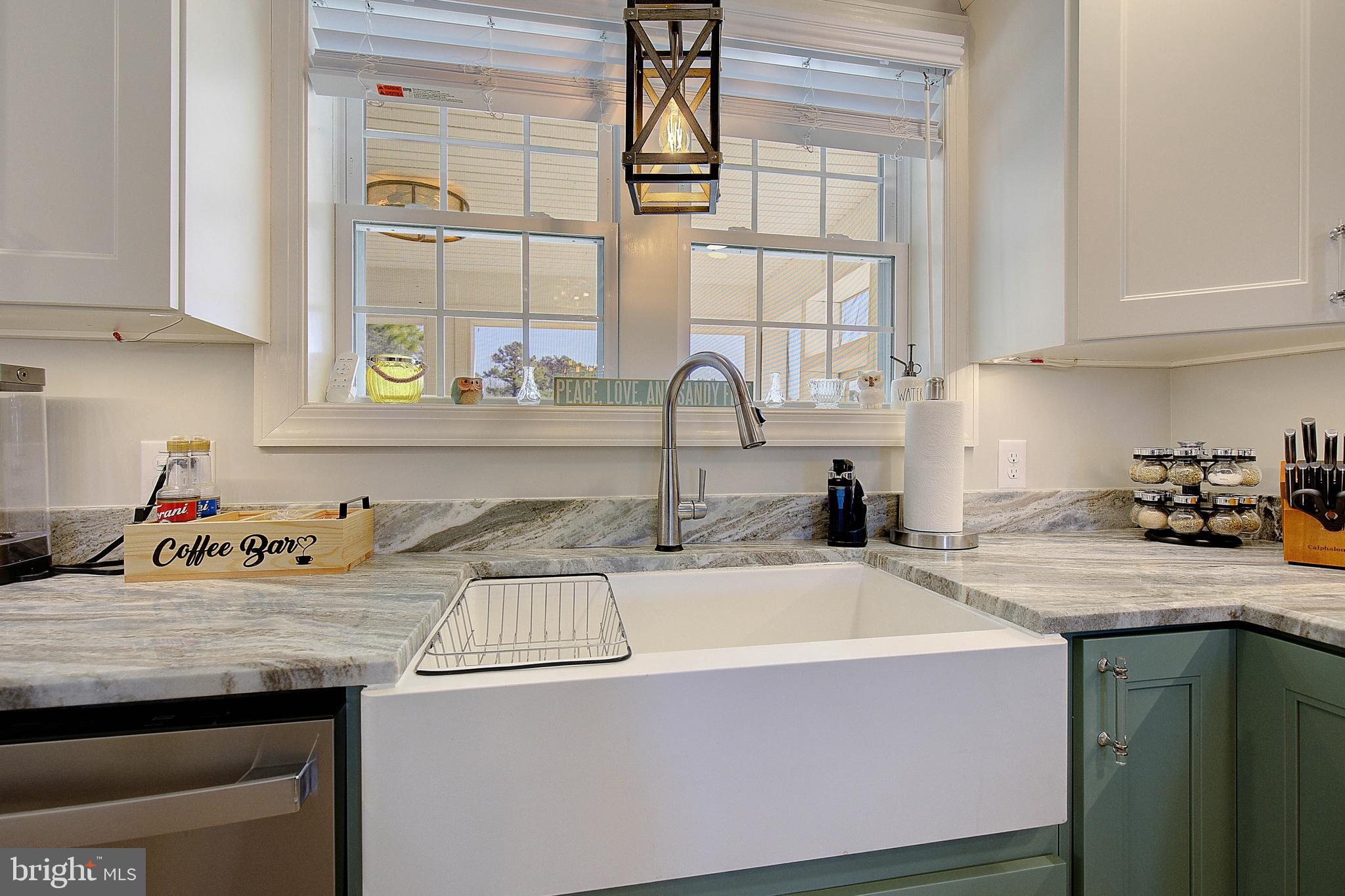 20938 Olen Mattingly Road Avenue, MD 20609 - Photo 12 of 47 a kitchen with a sink a stove and cabinets