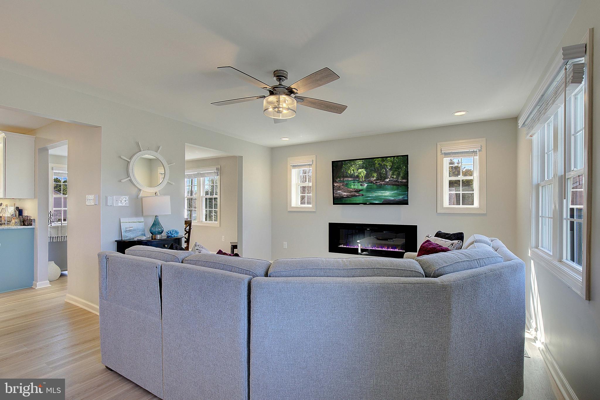 20938 Olen Mattingly Road Avenue, MD 20609 - Photo 14 of 47 a living room with furniture and a fireplace