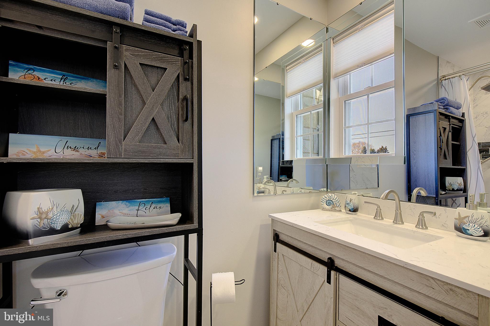 20938 Olen Mattingly Road Avenue, MD 20609 - Photo 25 of 47 a bathroom with a sink and a mirror