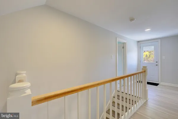 a view of staircase with white walls
