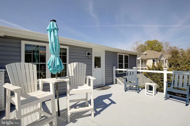 a view of a patio with a table and chairs