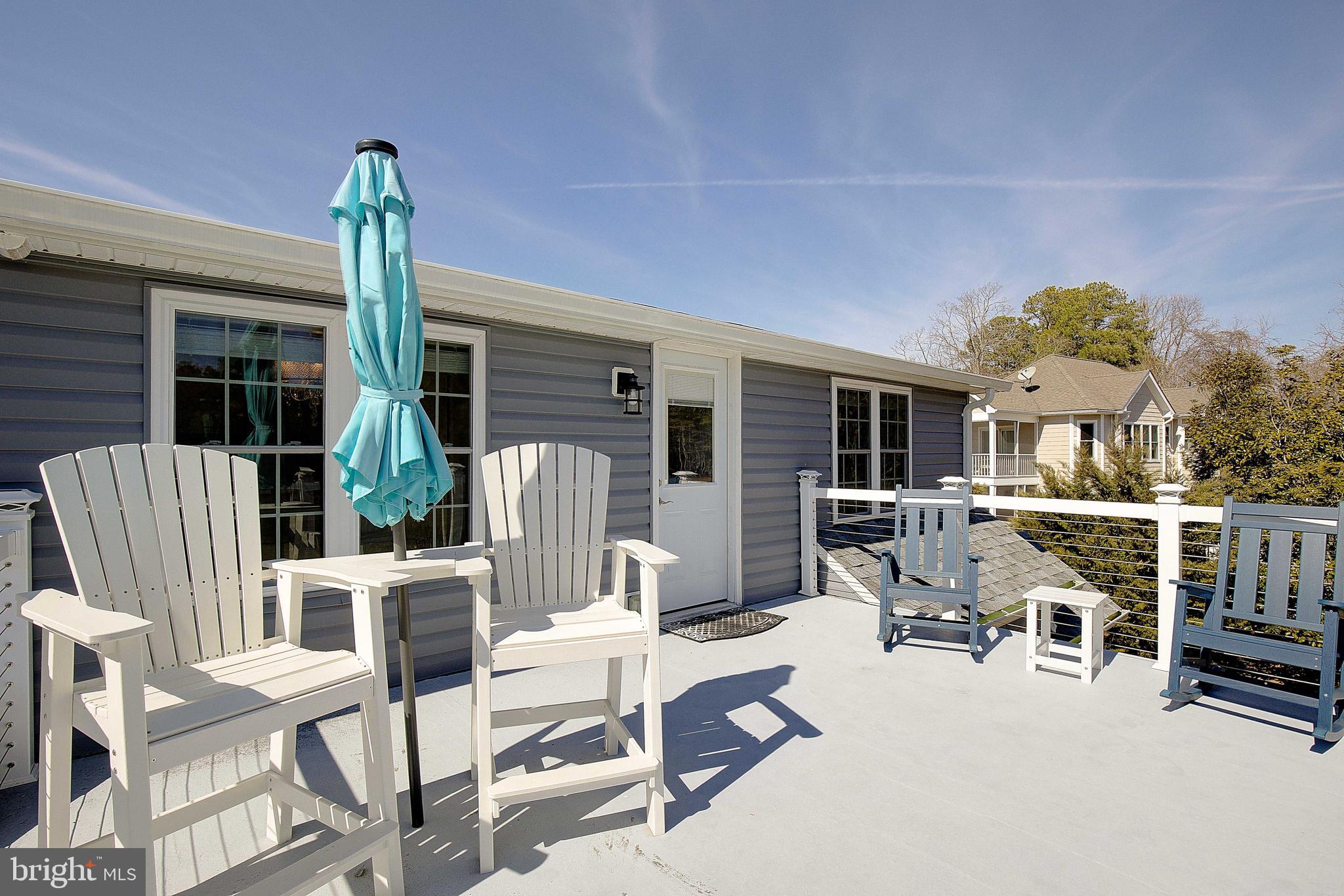 20938 Olen Mattingly Road Avenue, MD 20609 - Photo 29 of 47 a view of a patio with a table and chairs