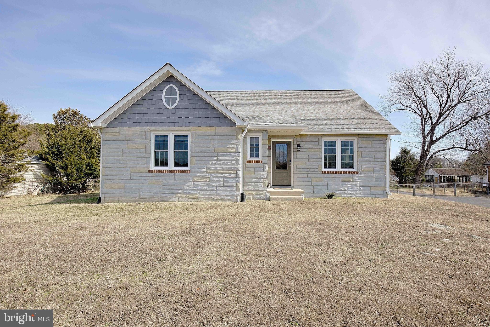 20938 Olen Mattingly Road Avenue, MD 20609 - Photo 3 of 47 a front view of a house with yard and trees