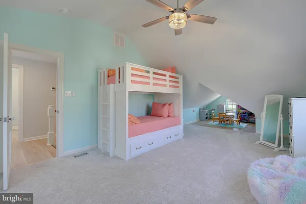 a workspace with furniture window and wooden floor