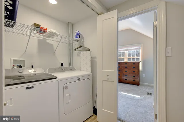 a view of a dining room with furniture large windows and wooden floor