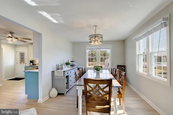 a view of a dining room with furniture window and wooden floor