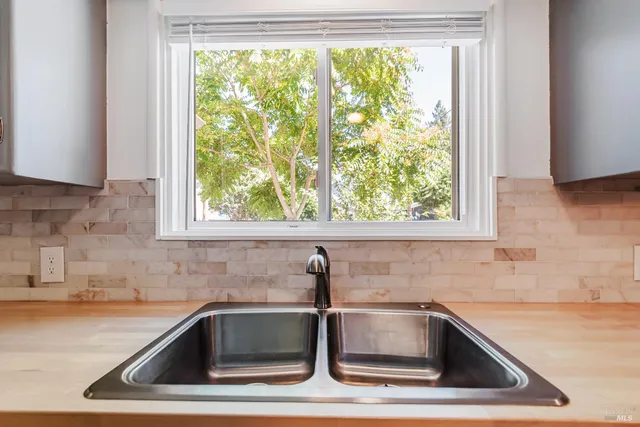 a kitchen with a sink and a window