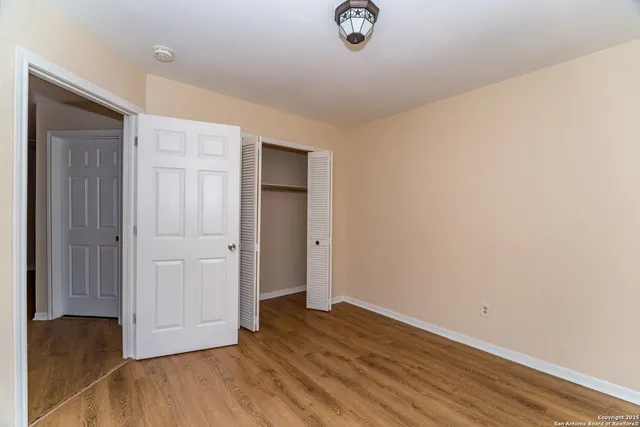 a view of a livingroom with wooden floor