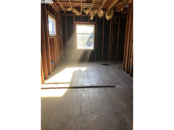 a view of a hallway with windows