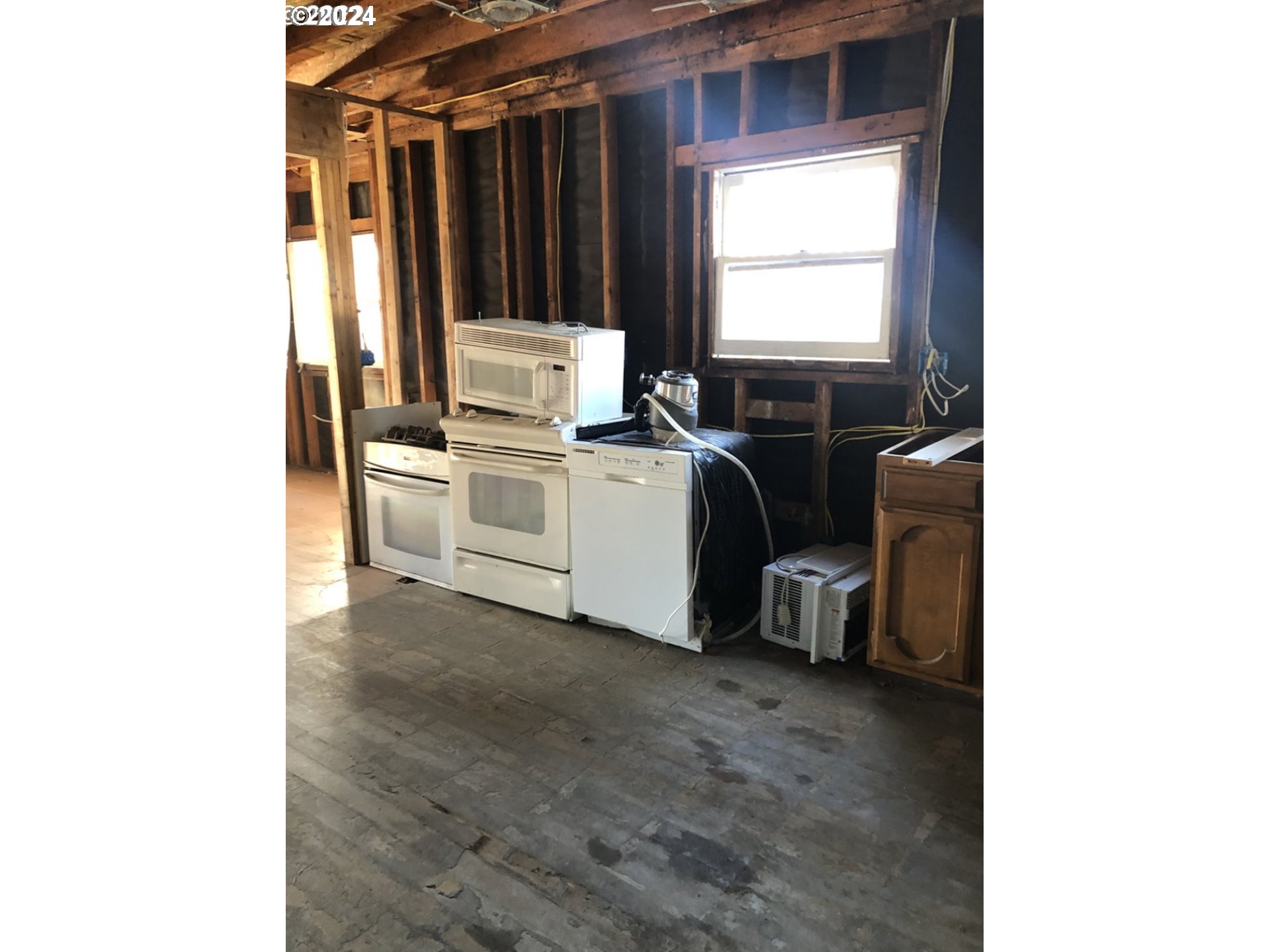 176 North Street Vernonia, OR 97064 - Photo 14 of 19 a room with a chair and a washer dryer