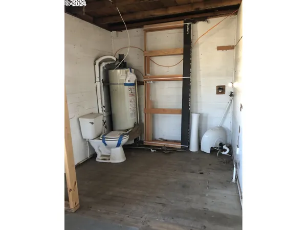 a bathroom with a toilet and shower