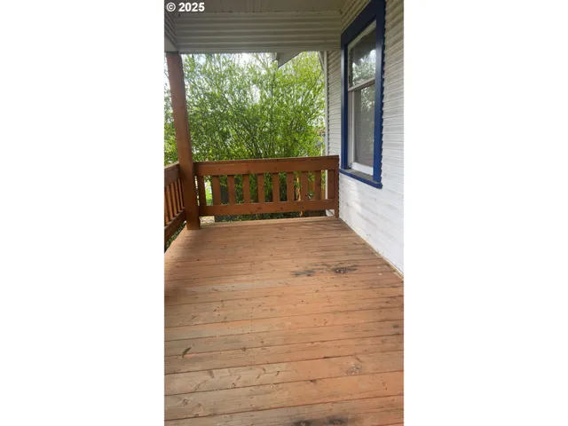 a view of a porch with a yard