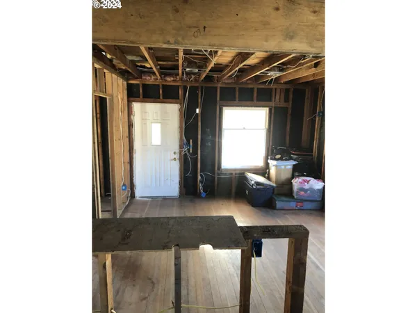 a view of a porch with furniture and a yard