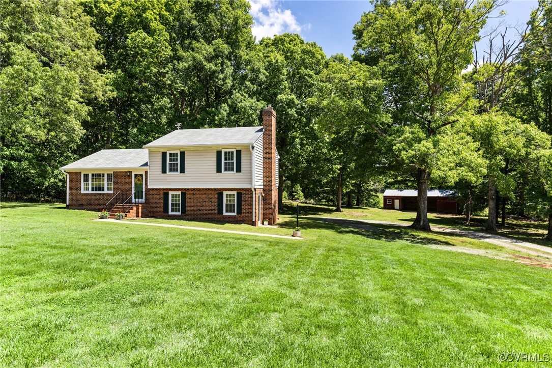2137 Dogtown Road Goochland, VA 23063 - Photo 3 of 40 Split level home featuring a chimney, a front yard