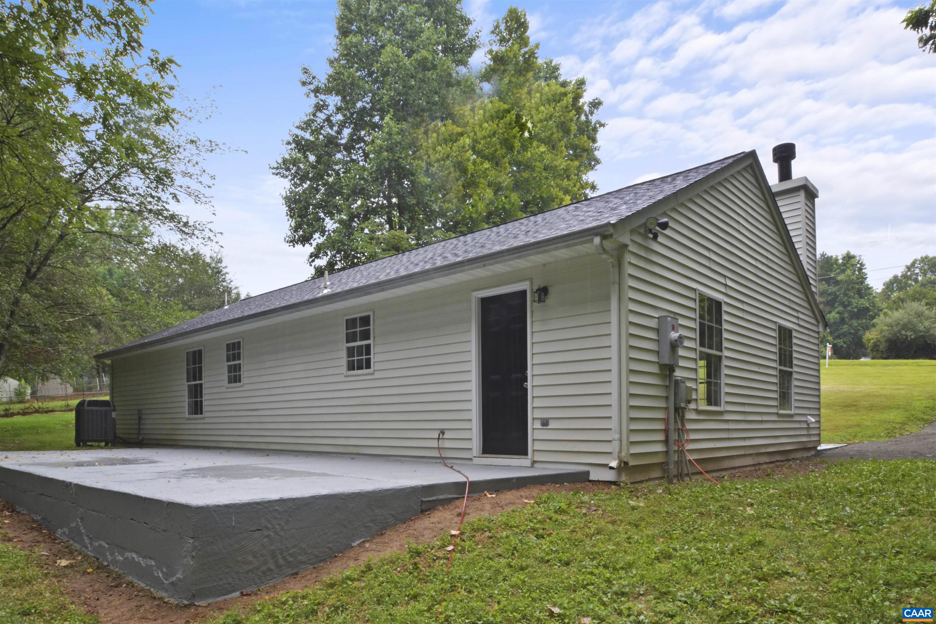 263 Morning Glory Road Ruckersville, VA 22968 - Photo 23 of 24 a front view of a house with garage