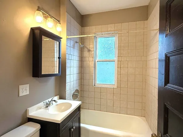 a bathroom with a sink and a bathtub