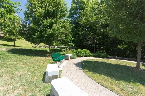 a view of a backyard with swimming pool