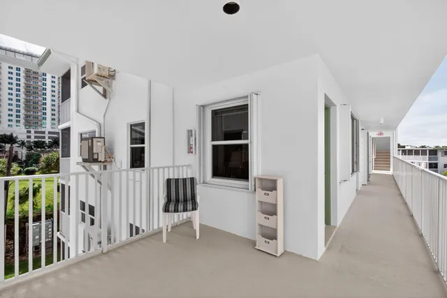 a view of swimming pool from a balcony