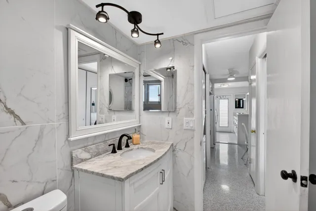 a bedroom with a bed and a table