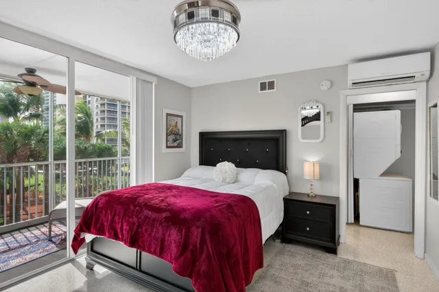 a bedroom with a bed and a mirror