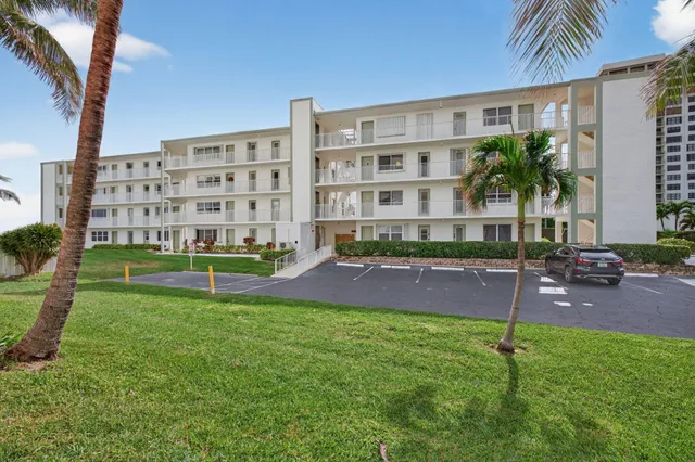 a view of a room with window and refrigerator