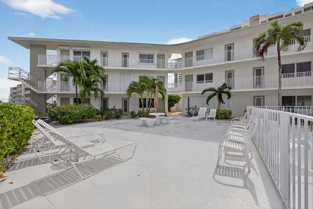a view of a garden with an outdoor seating
