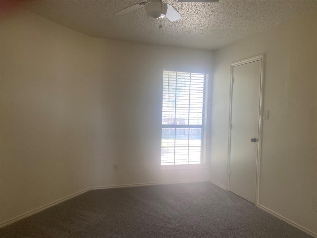 2809 Wimbledon Court, Unit C Garland, TX 75041 - Photo 21 of 23 an empty room with windows