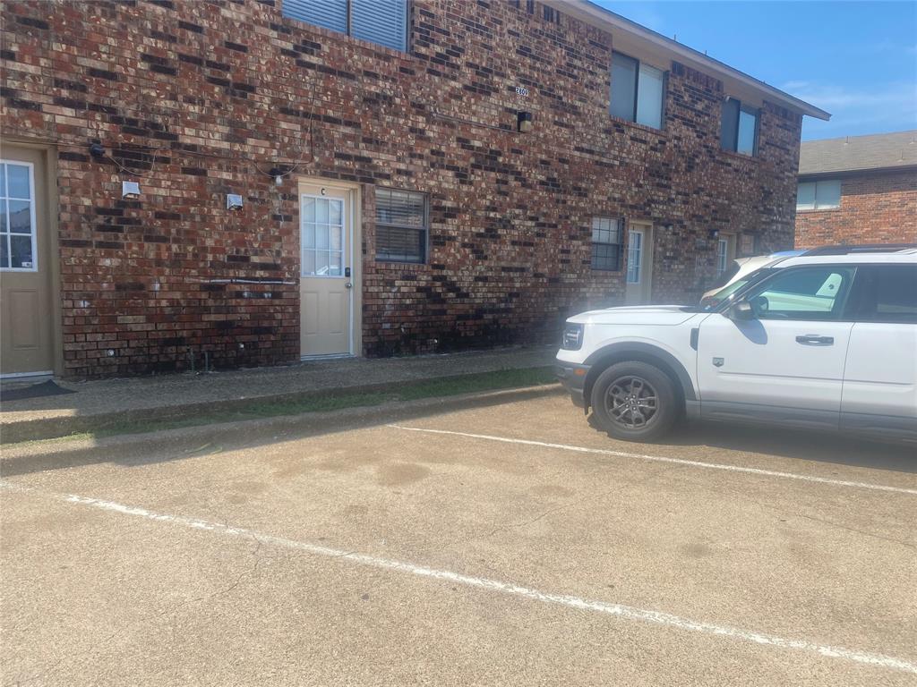 2809 Wimbledon Court, Unit C Garland, TX 75041 - Photo 23 of 23 a car parked in front of a building
