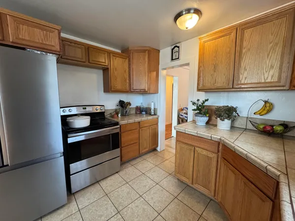 a kitchen with a sink cabinets and appliances
