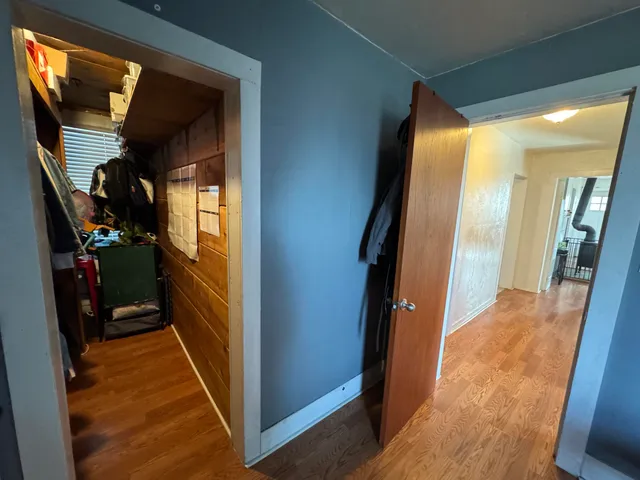 a view of a livingroom with furniture and hardwood floor