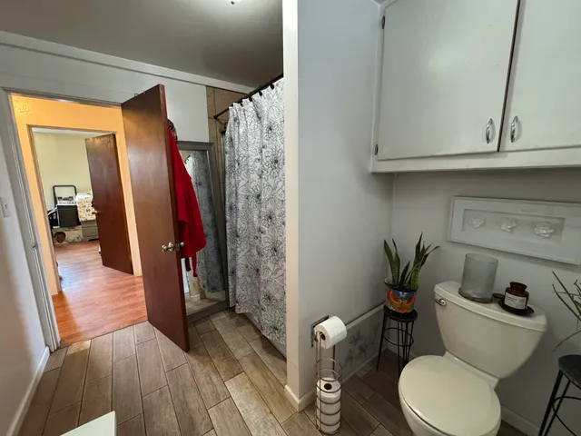 a view of a workspace with furniture and floor to ceiling window