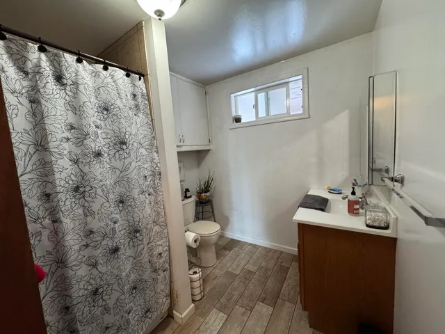 a living room with furniture a rug and a wall