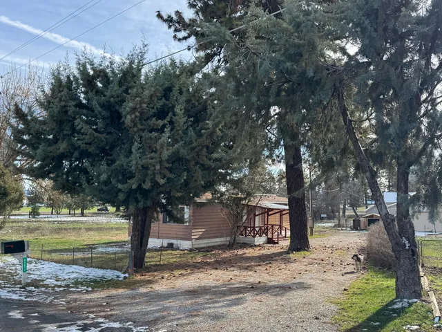 a kitchen with stainless steel appliances granite countertop a refrigerator and a stove