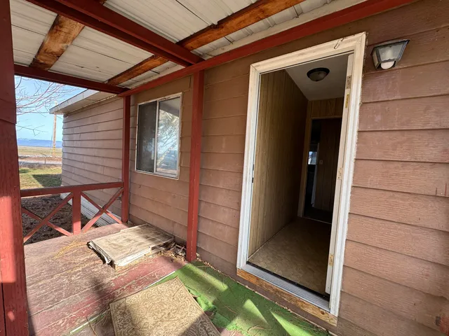 a view of a hallway with windows