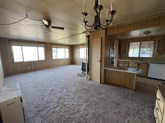 a view of an empty room with windows