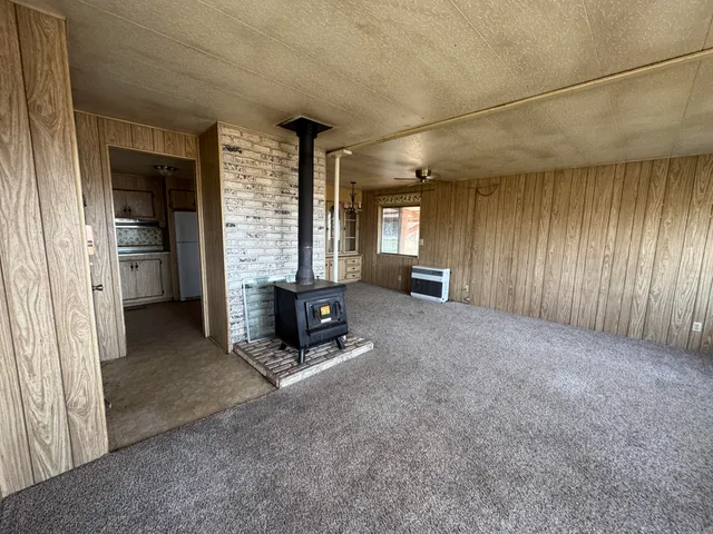 a bathroom with a granite countertop sink and mirror