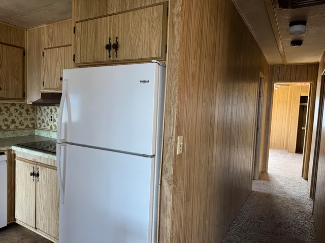 a view of a house with a yard and garage