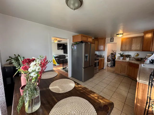 a kitchen with a refrigerator and a sink