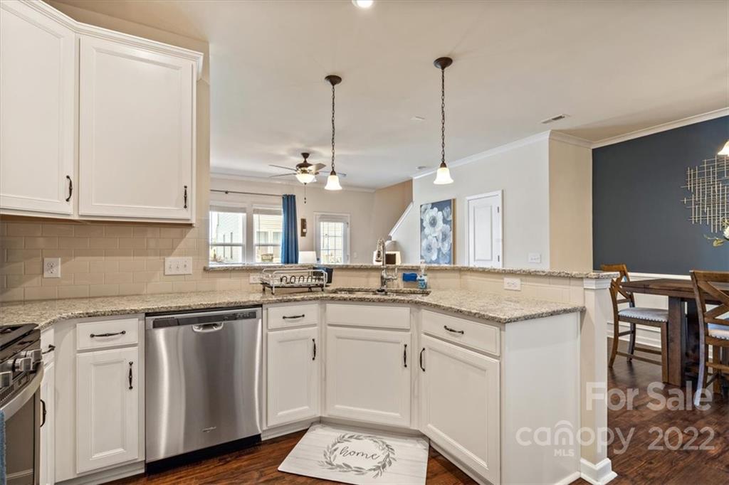 530 Hunters Dance Road Fort Mill, SC 29708 - Photo 11 of 35 a kitchen with granite countertop white cabinets and white appliances