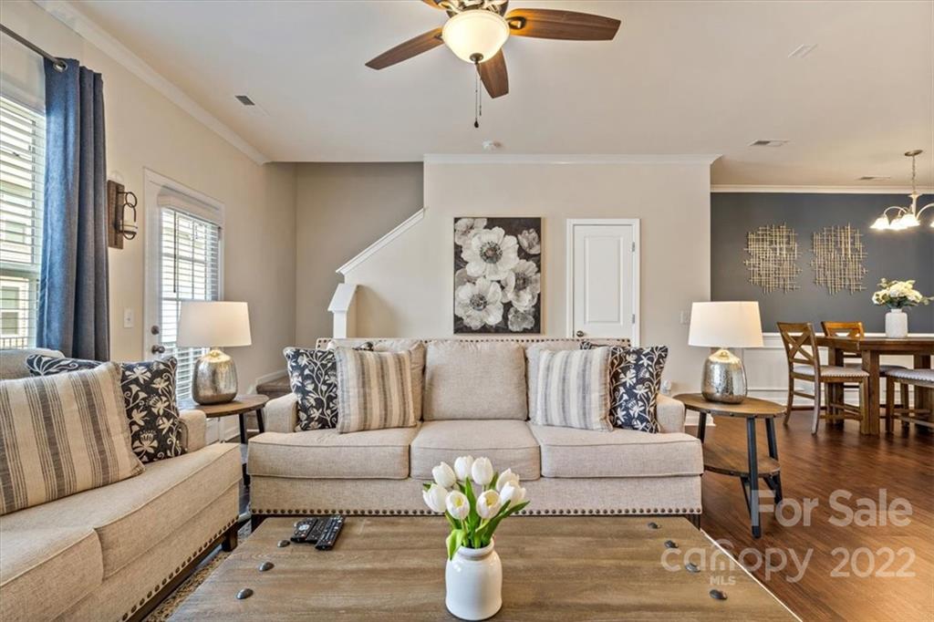 530 Hunters Dance Road Fort Mill, SC 29708 - Photo 15 of 35 a living room with furniture and a chandelier