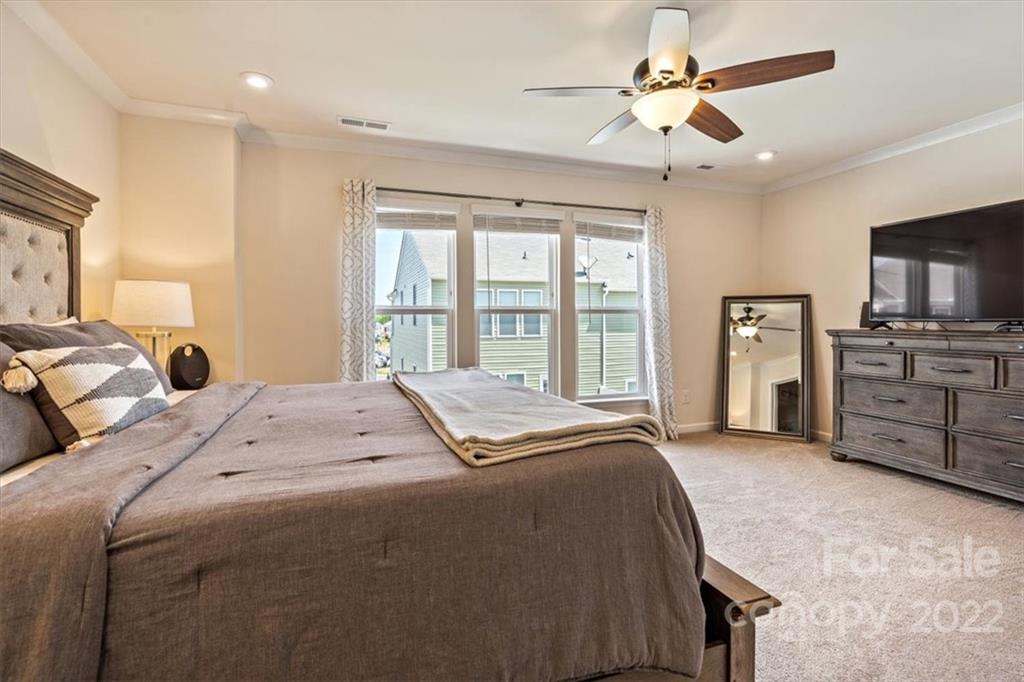 530 Hunters Dance Road Fort Mill, SC 29708 - Photo 20 of 35 a bedroom with a bed dresser and a flat tv screen