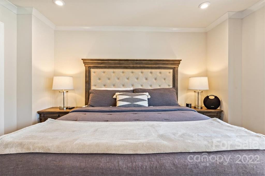 530 Hunters Dance Road Fort Mill, SC 29708 - Photo 21 of 35 a bedroom with a bed and lamp on table